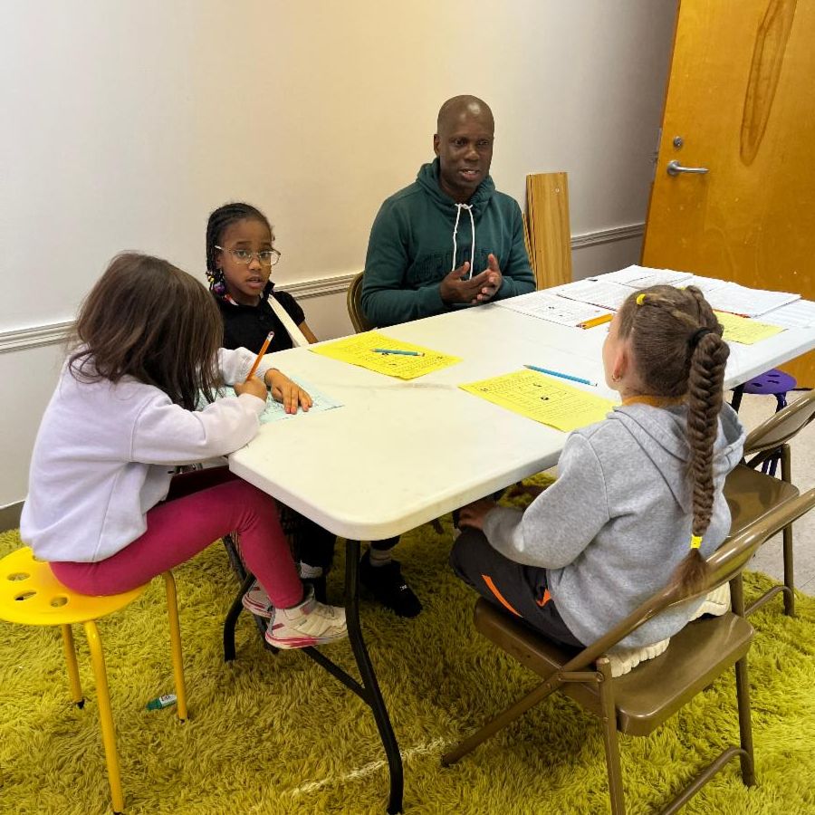 IPiE Graduate Student tutor works with students at the Black Child Development Institute Greensboro.